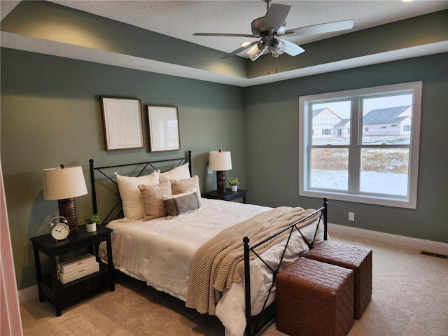 bedroom with light carpet and ceiling fan