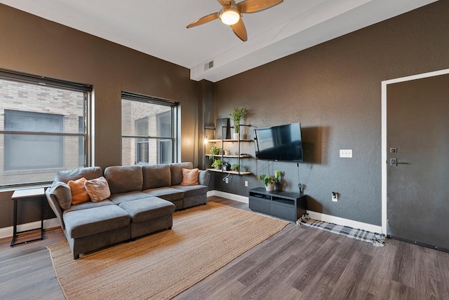 living room with hardwood / wood-style flooring and ceiling fan