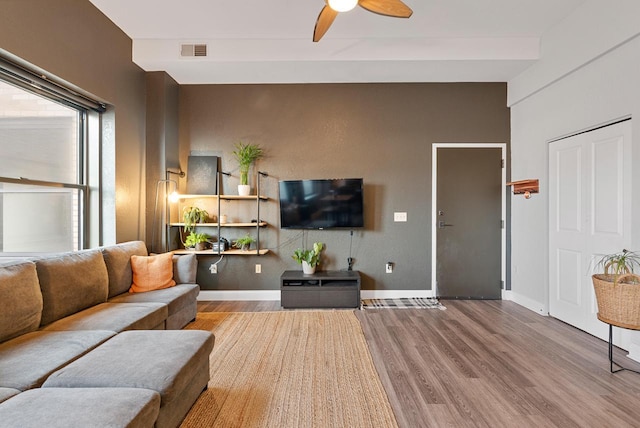 living room with ceiling fan and light hardwood / wood-style floors