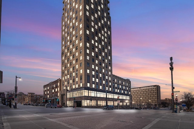 view of outdoor building at dusk