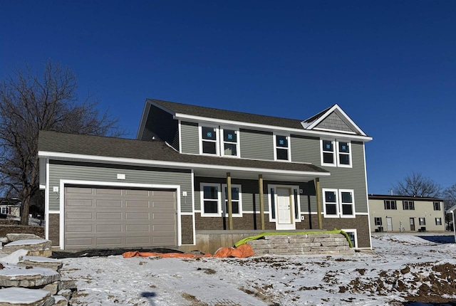 view of property featuring a garage and a porch