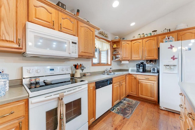 kitchen featuring sink, white appliances, light hardwood / wood-style flooring, and lofted ceiling