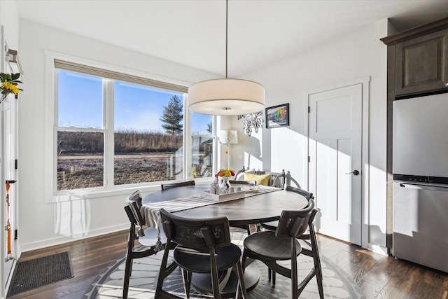 dining space featuring dark hardwood / wood-style flooring