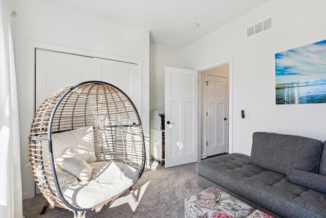 sitting room featuring carpet flooring