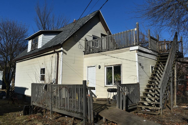 back of house with a balcony