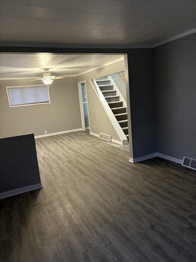 unfurnished room featuring hardwood / wood-style flooring, ceiling fan, and ornamental molding