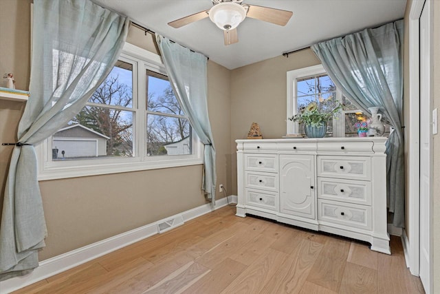 bedroom with ceiling fan and light wood-type flooring