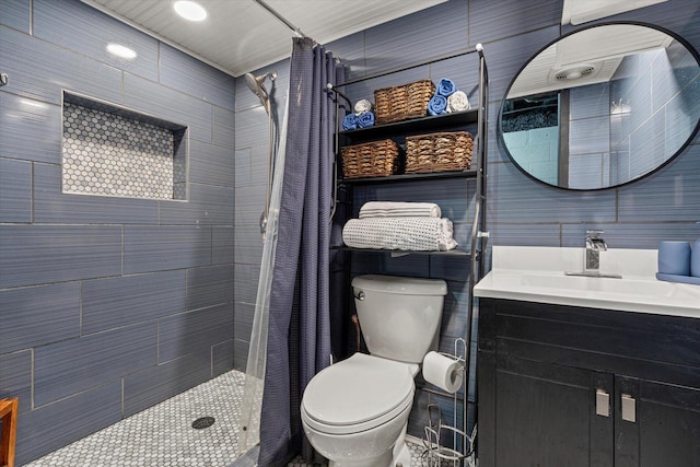 bathroom with toilet, vanity, and a shower with shower curtain