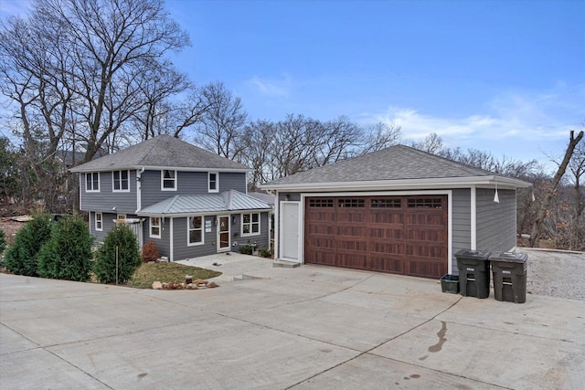 front of property with a garage