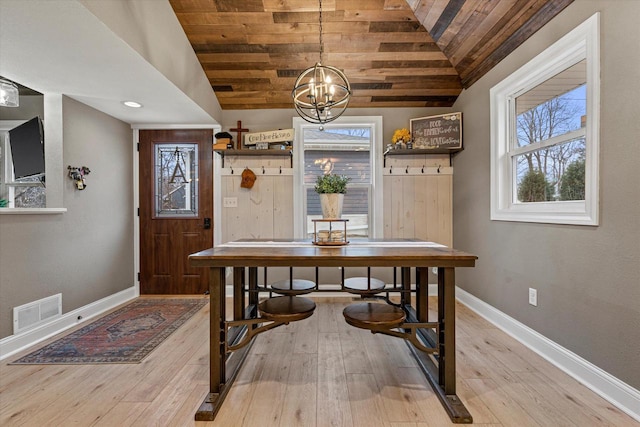 dining space with a notable chandelier, wood ceiling, light hardwood / wood-style flooring, and vaulted ceiling