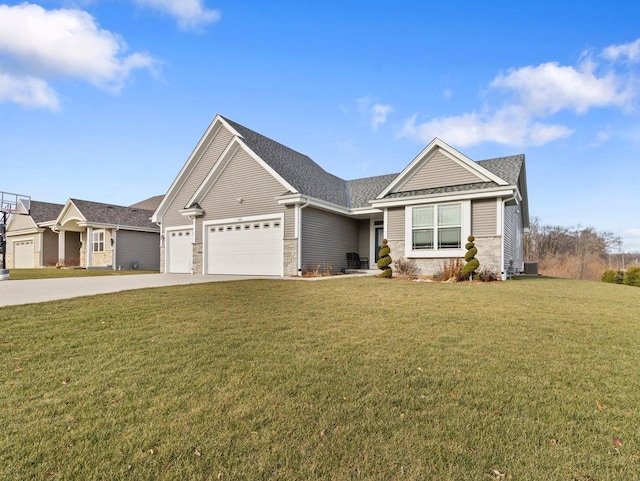 view of front of property featuring a garage and a front yard