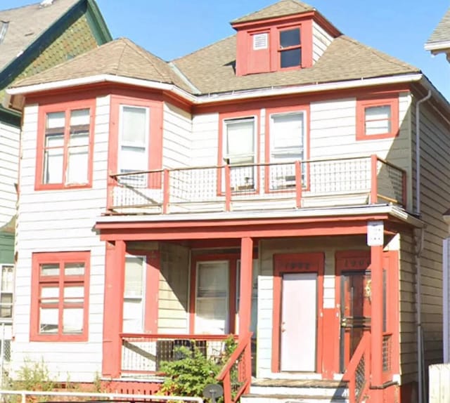 view of front of home featuring a balcony and a porch