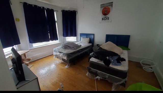 bedroom featuring wood-type flooring