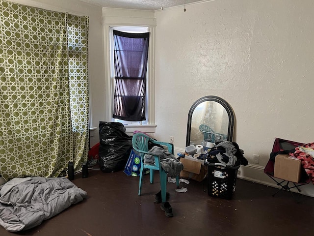 miscellaneous room with a textured ceiling