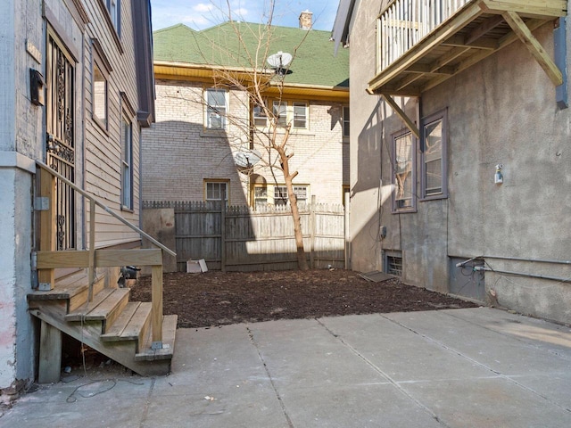 view of patio featuring a balcony