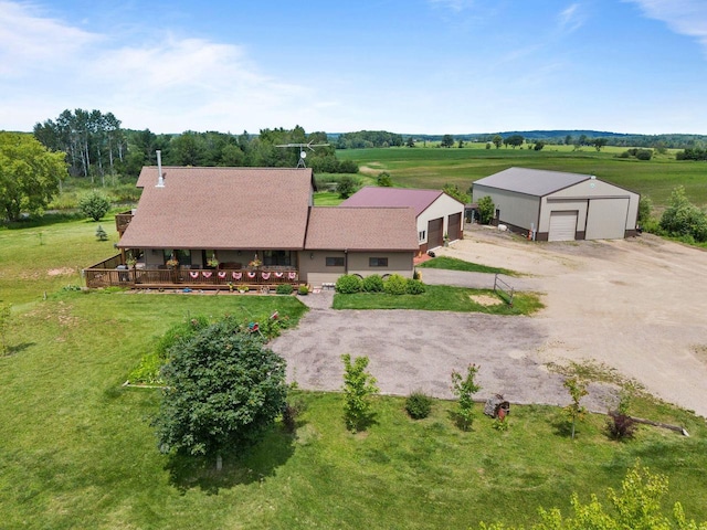 birds eye view of property with a rural view