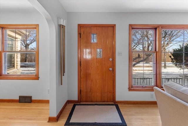 foyer entrance with light hardwood / wood-style flooring