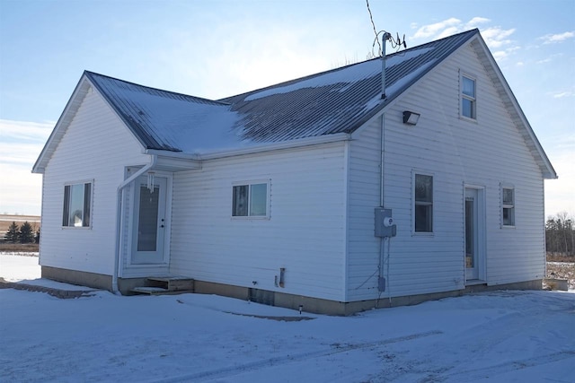 view of snow covered house