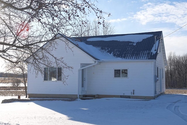 view of snow covered house