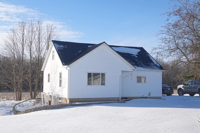 view of snow covered house