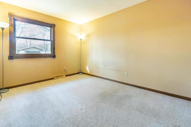 unfurnished room with light colored carpet