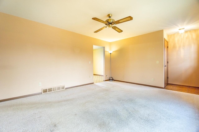 unfurnished room featuring carpet flooring and ceiling fan