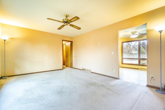 carpeted empty room with ceiling fan