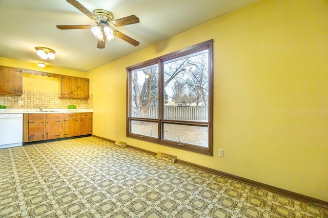 kitchen with tasteful backsplash, ceiling fan, and white dishwasher