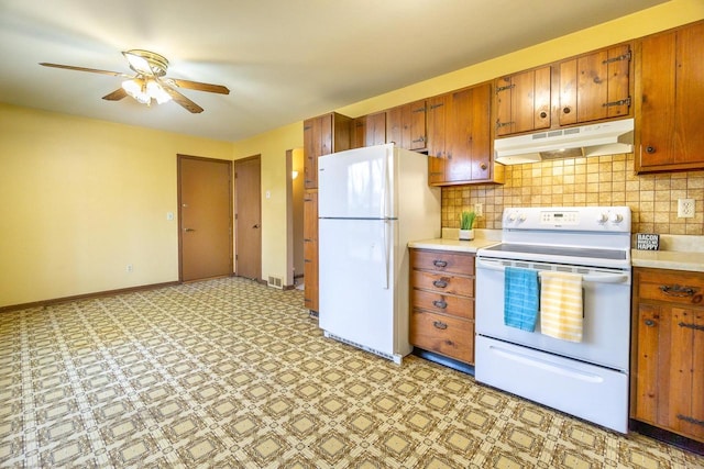 kitchen with white appliances, decorative backsplash, and ceiling fan