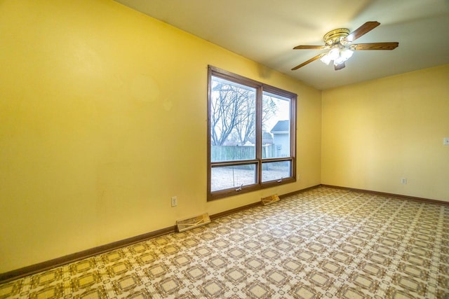 unfurnished room featuring ceiling fan