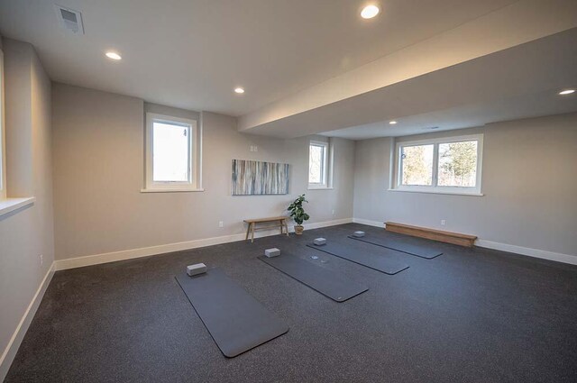 workout room with baseboard heating