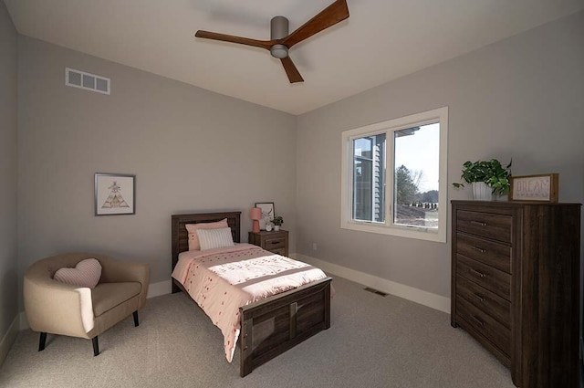 bedroom featuring light carpet and ceiling fan