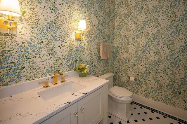 bathroom with vanity, tile patterned floors, and toilet