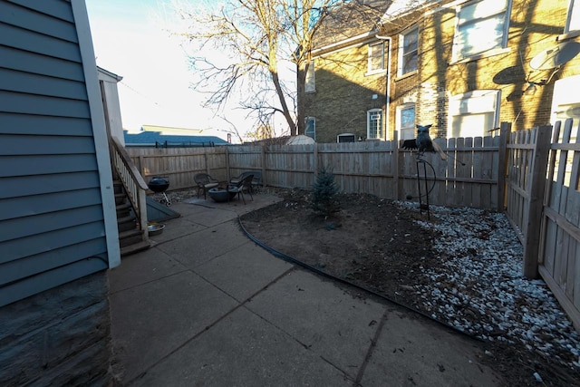 view of patio / terrace with an outdoor fire pit