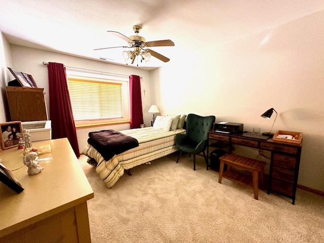 bedroom featuring light carpet and ceiling fan