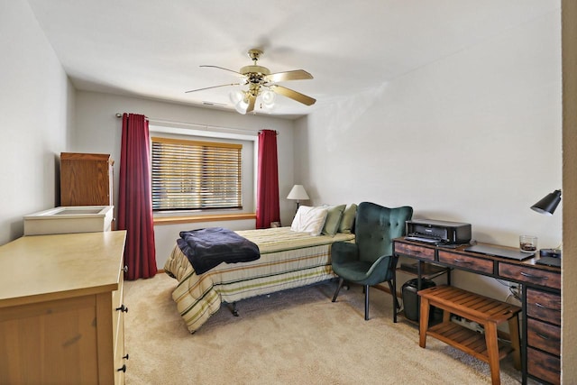 bedroom with ceiling fan and light carpet