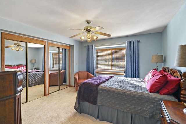 bedroom featuring ceiling fan and light carpet