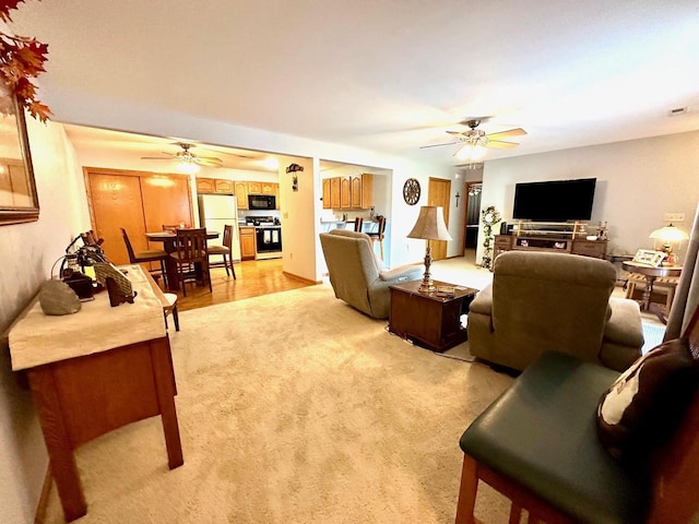 living room with ceiling fan and light carpet