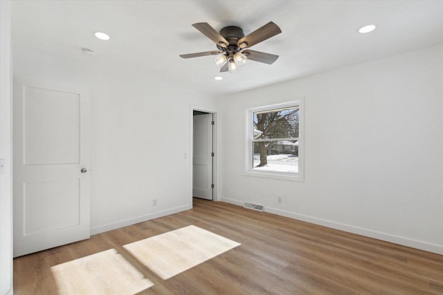 unfurnished bedroom with ceiling fan and light hardwood / wood-style floors