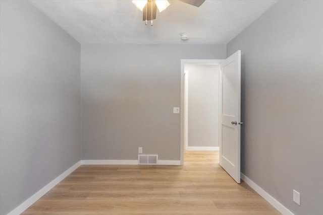 spare room with ceiling fan and light hardwood / wood-style flooring