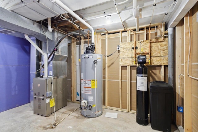 utility room with heating unit and gas water heater