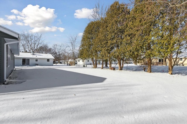 view of yard covered in snow