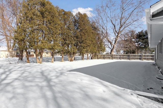 view of yard layered in snow