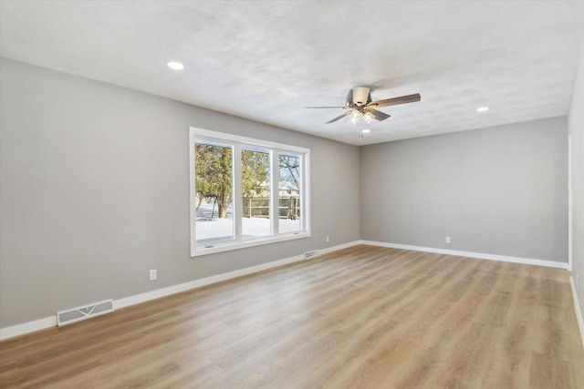 unfurnished room featuring light hardwood / wood-style floors and ceiling fan