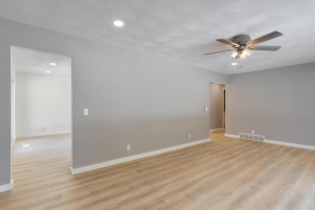 unfurnished room featuring ceiling fan and light hardwood / wood-style flooring