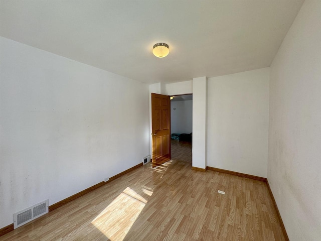 empty room featuring light hardwood / wood-style floors