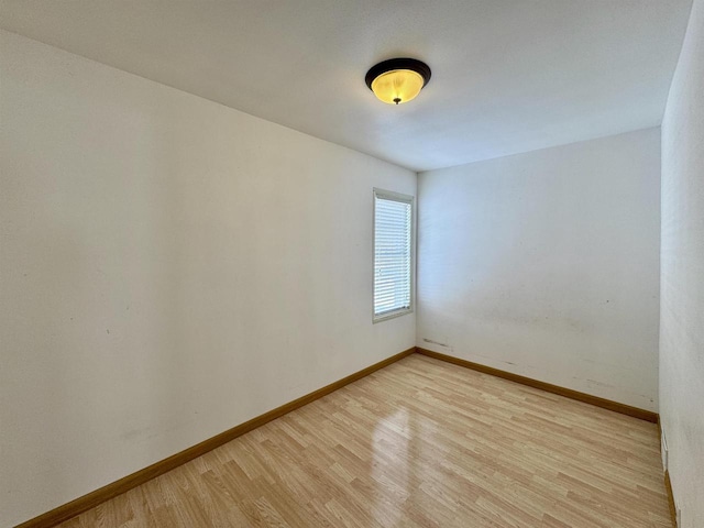 empty room with light hardwood / wood-style floors