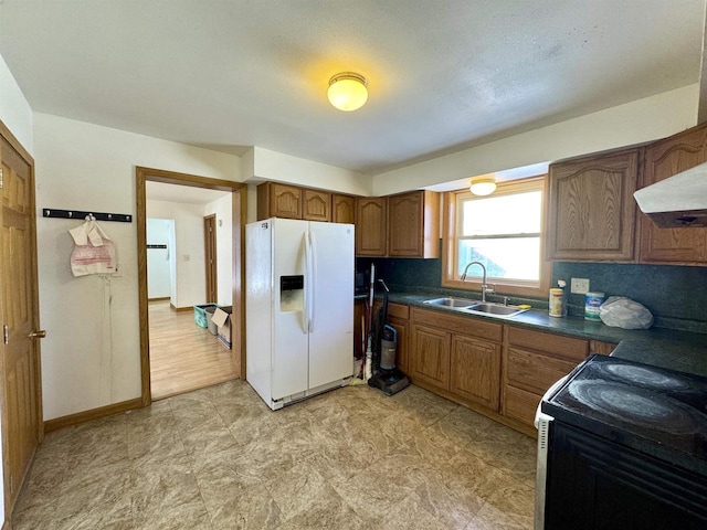 kitchen featuring sink, custom exhaust hood, black electric range, white fridge with ice dispenser, and backsplash