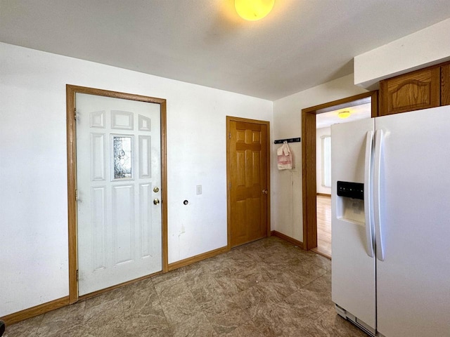 kitchen with white fridge with ice dispenser