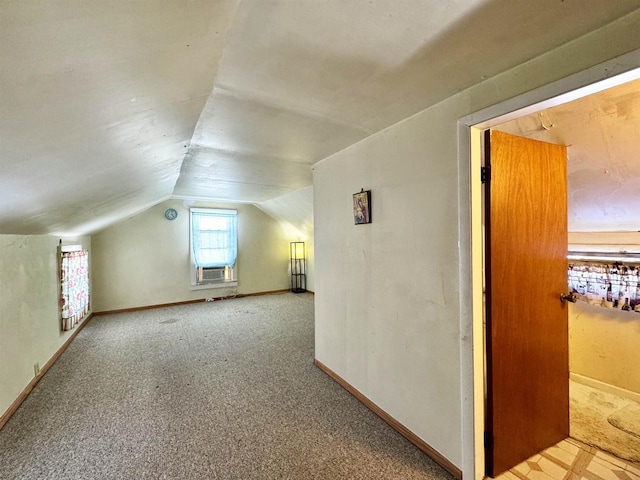 bonus room featuring cooling unit, lofted ceiling, and carpet floors